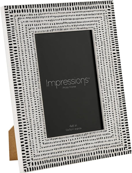White photo frame with black geometric pattern on a white background.