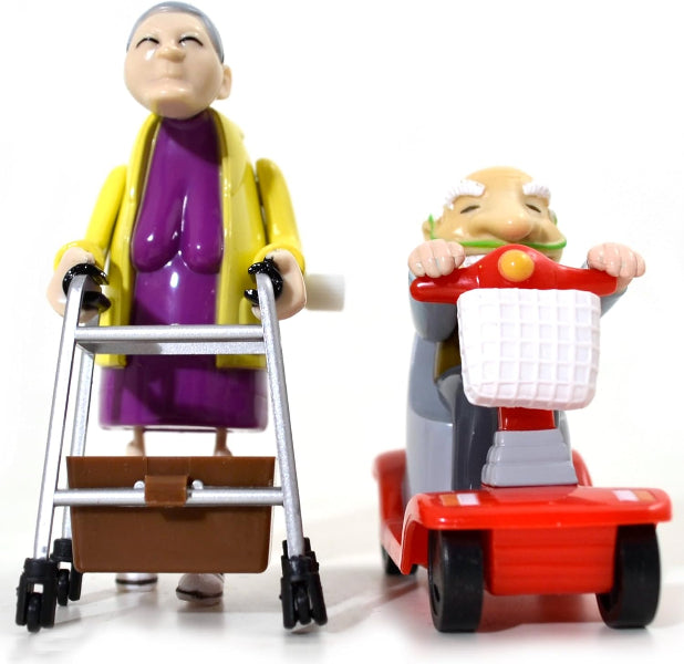 Toy figure of an elderly woman with a walker and a toy figure of an elderly man on a scooter.