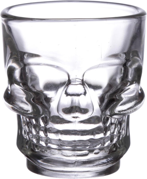 Clear glass skull-shaped shot glass on a white background