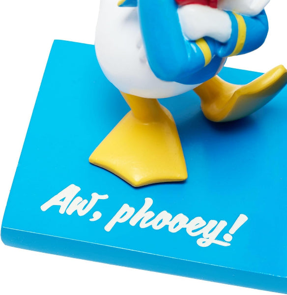 Cartoon character figurine with a blue base and 'Aw, phooey!' text
