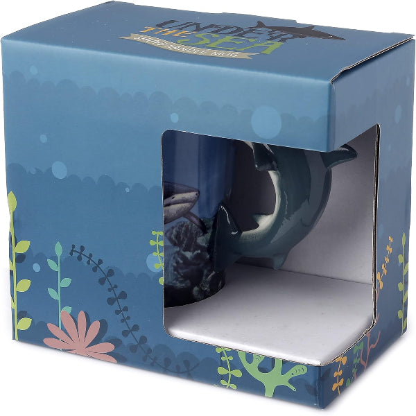 Blue mug in a decorative box with floral patterns