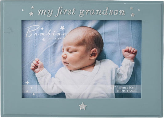 A square photo frame in a dusty blue-gray color with silver text reading 'my first grandson' and 'Bambino' on the insert photo, featuring a sleeping baby in a white outfit lying on a blue blanket.