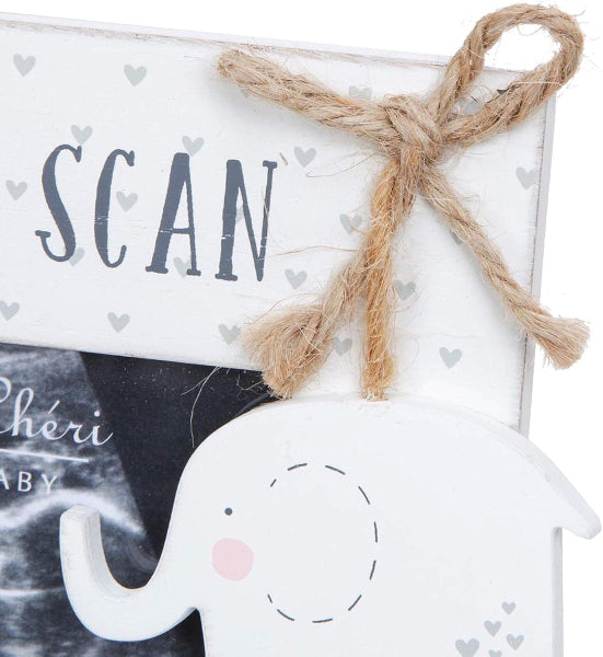 Decorative sign with 'SCAN' and an elephant-shaped object on a white background with hearts.