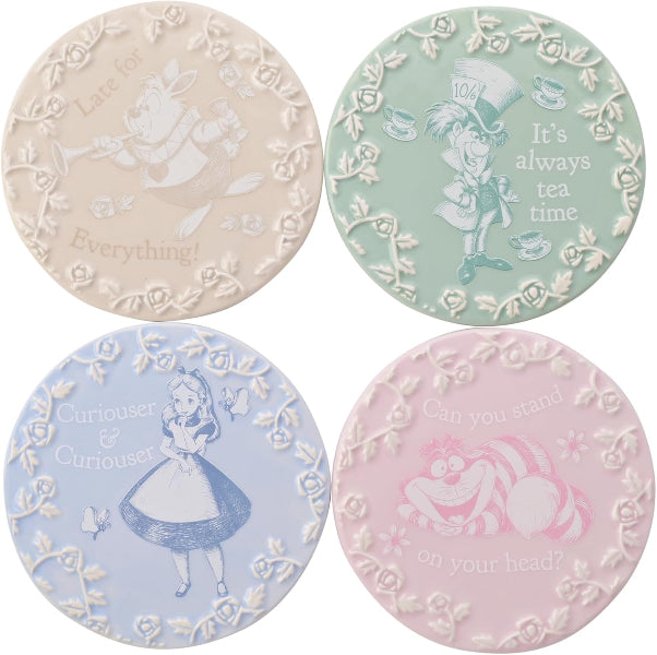 Set of four circular coasters with Alice in Wonderland-themed designs on a white background.