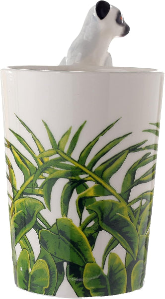 Tumbler with a lemur design on top and tropical leaf pattern on the side