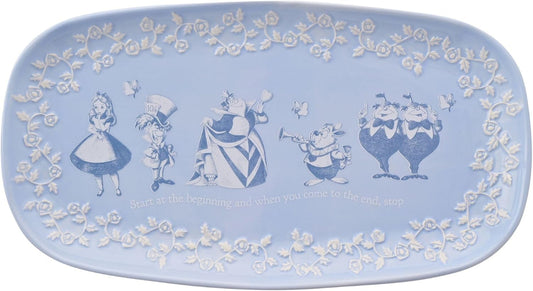 Decorative plate with animated characters and floral patterns on a light blue background
