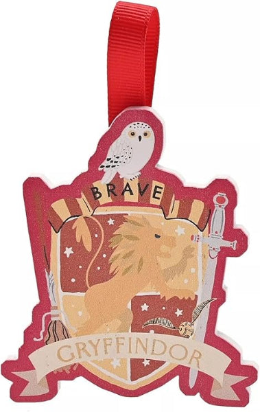 Gryffindor crest with lion, owl, and sword on a red background