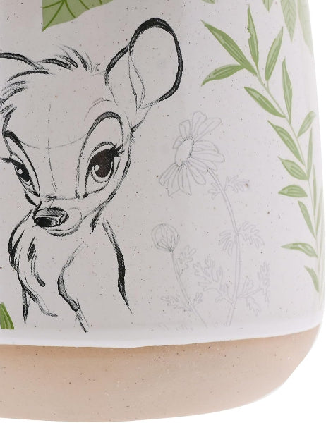 Close-up of a product with a deer illustration and floral design.