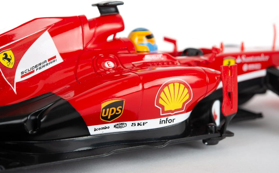Red Formula 1 car with various sponsor logos on a gray background