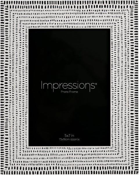 A black and white patterned Impressions photo frame shown from the back, featuring a central black insert with white text reading 'Impressions Photo Frame' and size details.