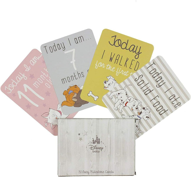 Set of baby milestone cards with cartoon illustrations and text on a white background