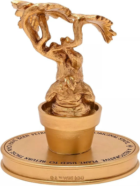Gold trophy with intricate design on a white background