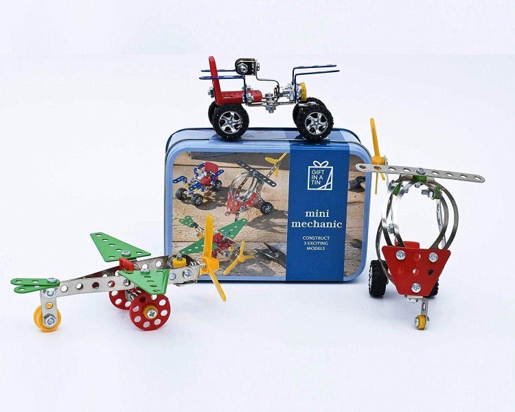 Toy construction set with model airplane, car, and helicopter on a white background