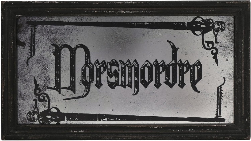 Decorative sign with 'Morsmordre' in gothic font on a reflective surface.