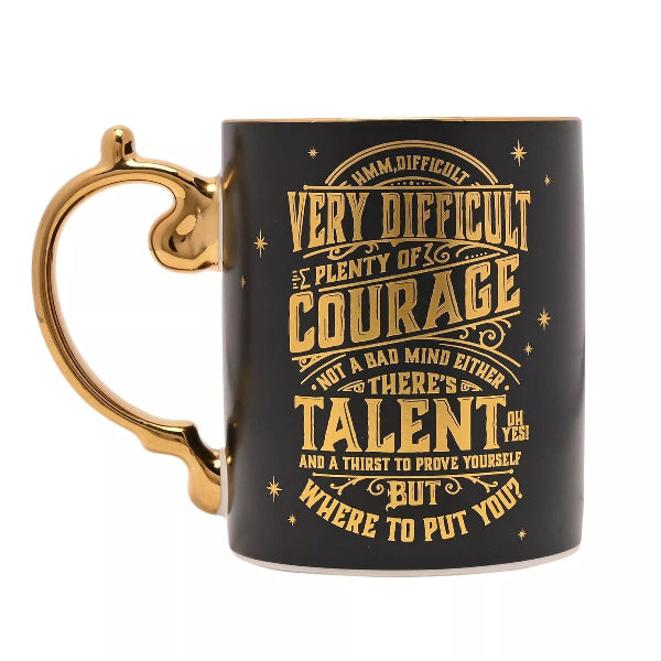 Black mug with gold text and handle on a white background