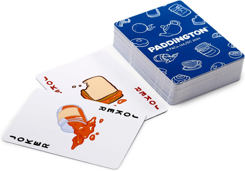 Stack of Paddington-themed playing cards with illustrations on a white background
