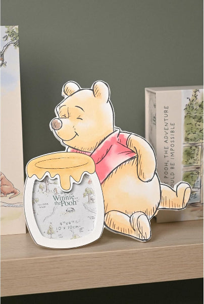 Cartoon bear holding a honey jar with a decorative background