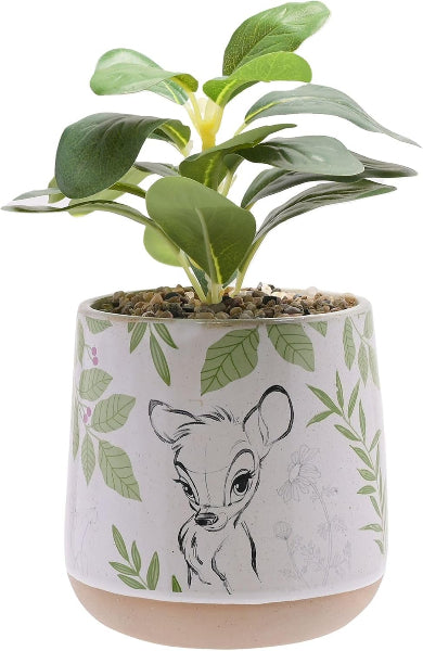 Potted plant in a decorative pot with a deer design on a white background