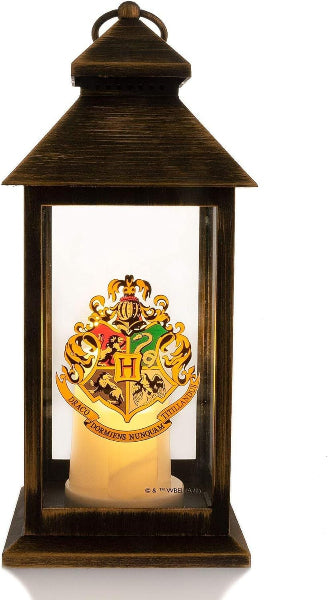 Wooden lantern with a candle inside featuring a Hogwarts crest design on a white background