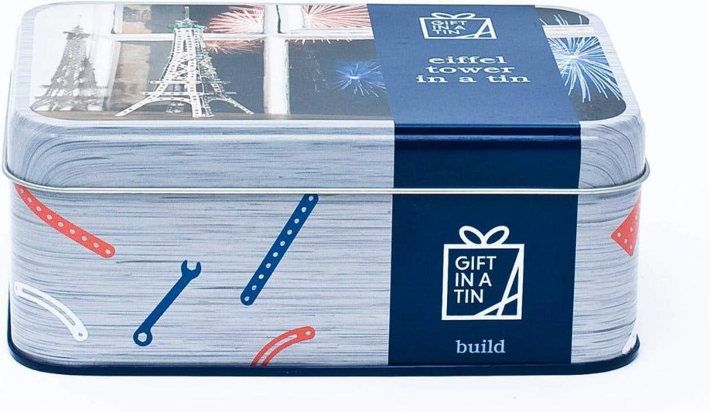 Gift in a tin packaging with tools and building elements on a blue background