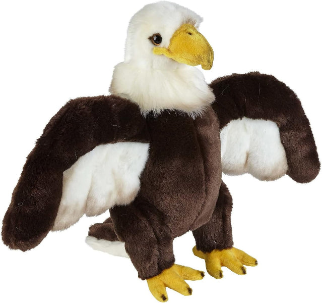 A plush stuffed eagle toy with a white head and neck, dark brown body, white wing patches, and yellow beak and feet, shown on a plain white background.