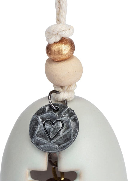 Decorative hanging ornament with a heart charm on a white background