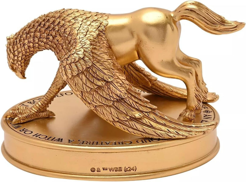 Gold panther figurine on a circular base with engraved text