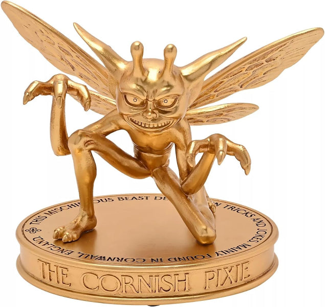 Gold figurine of a cornish pixie on a white background
