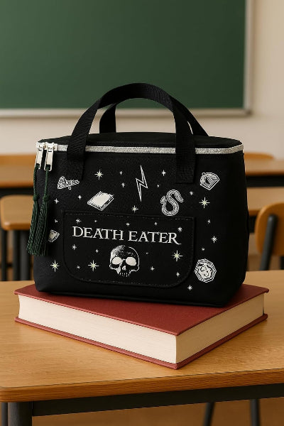 Black bag with 'DEATH EATER' text and symbols on a book in a classroom setting