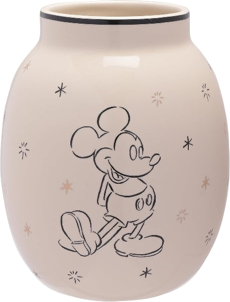 Beige ceramic vase with black line drawing of a character on a white background