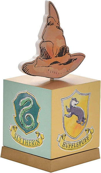 Wooden toy with Sorting Hat and Hogwarts House crests on a white background