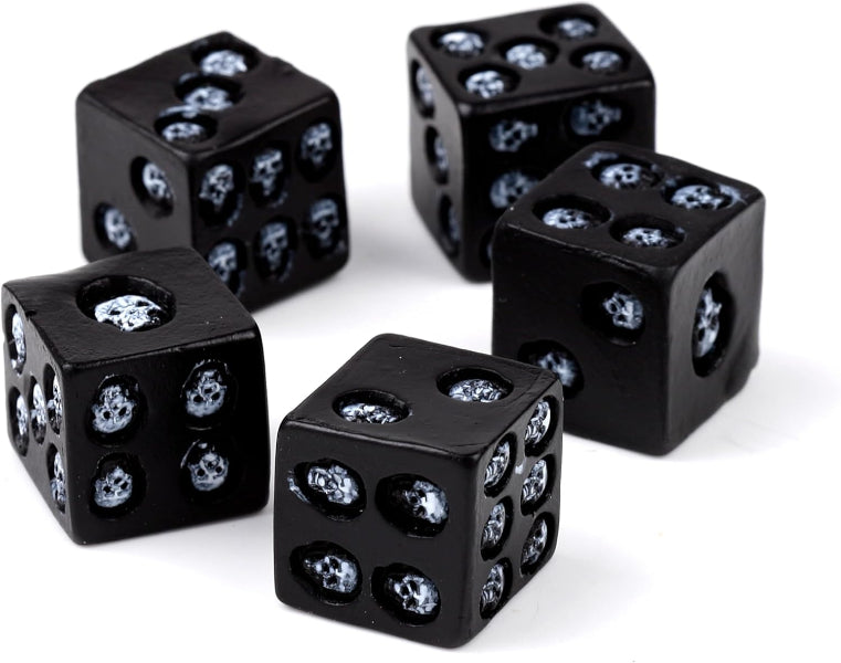 Set of black dice with skull designs on a white background
