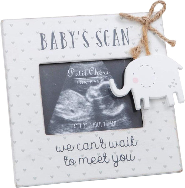 White photo frame with elephant decoration and ultrasound inside, on a white background