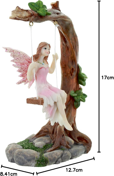 Fairy figurine on a swing with measurements indicated