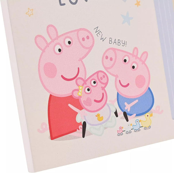 Card with Peppa Pig and family illustration and 'New Baby!' text on a light background