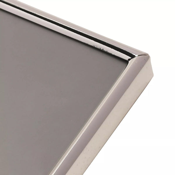 Close-up of a metallic frame corner with a reflective surface.