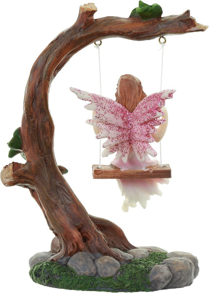 Decorative figurine of a fairy on a swing made of wood and stone, with pink wings.