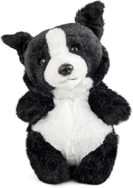 Plush toy resembling a black and white dog on a white background