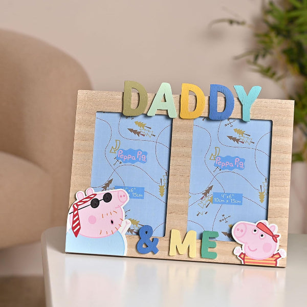 Wooden photo frame with 'Daddy & Me' text and Peppa Pig illustrations on a neutral background