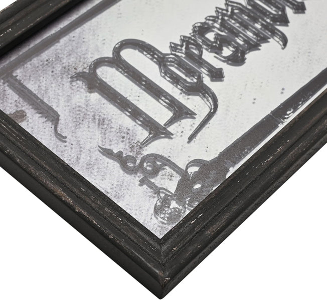 Decorative mirror with a black frame and engraved text on a white background