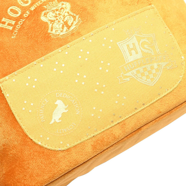 Close-up of a yellow and orange wallet with a logo, on a white background