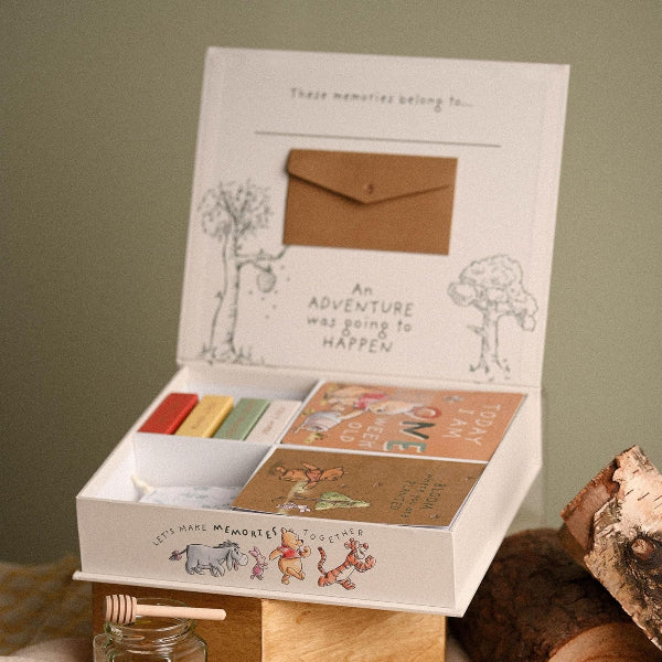 Memory box with cards and envelopes on a wooden surface