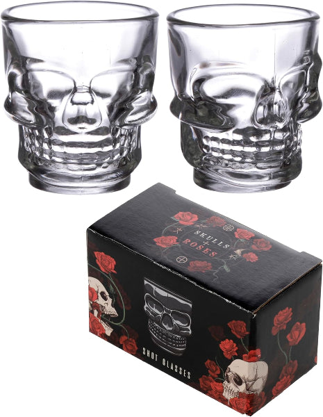 Two skull-shaped glass tumblers with a decorative box featuring a skull design.