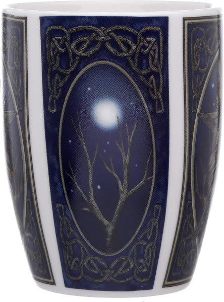 Decorative mug with Celtic knot design and tree silhouette against a night sky.