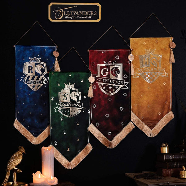 Four Harry Potter-themed banners representing different houses on a dark background with 'Ollivanders' branding.