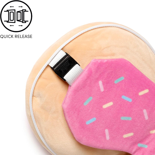 Pink eye mask with sprinkles on a beige background