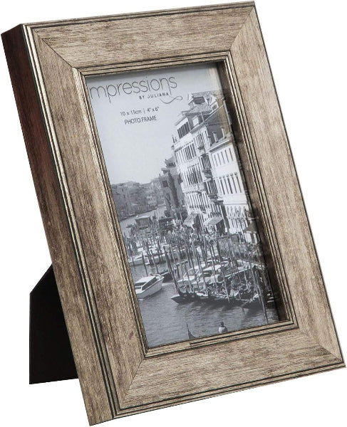 Wooden photo frame with a black and white photo of a canal scene.