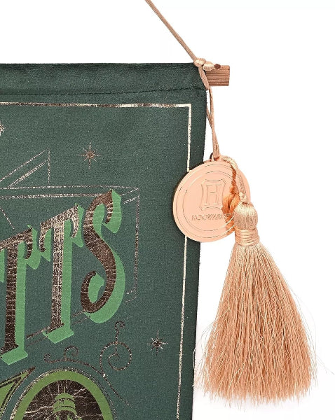 Decorative green book with gold text and a pink tassel on a white background