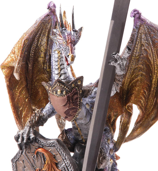 Decorative dragon figurine with detailed scales and wings on a white background
