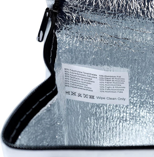 Close-up of a metallic pouch with a label on a white background